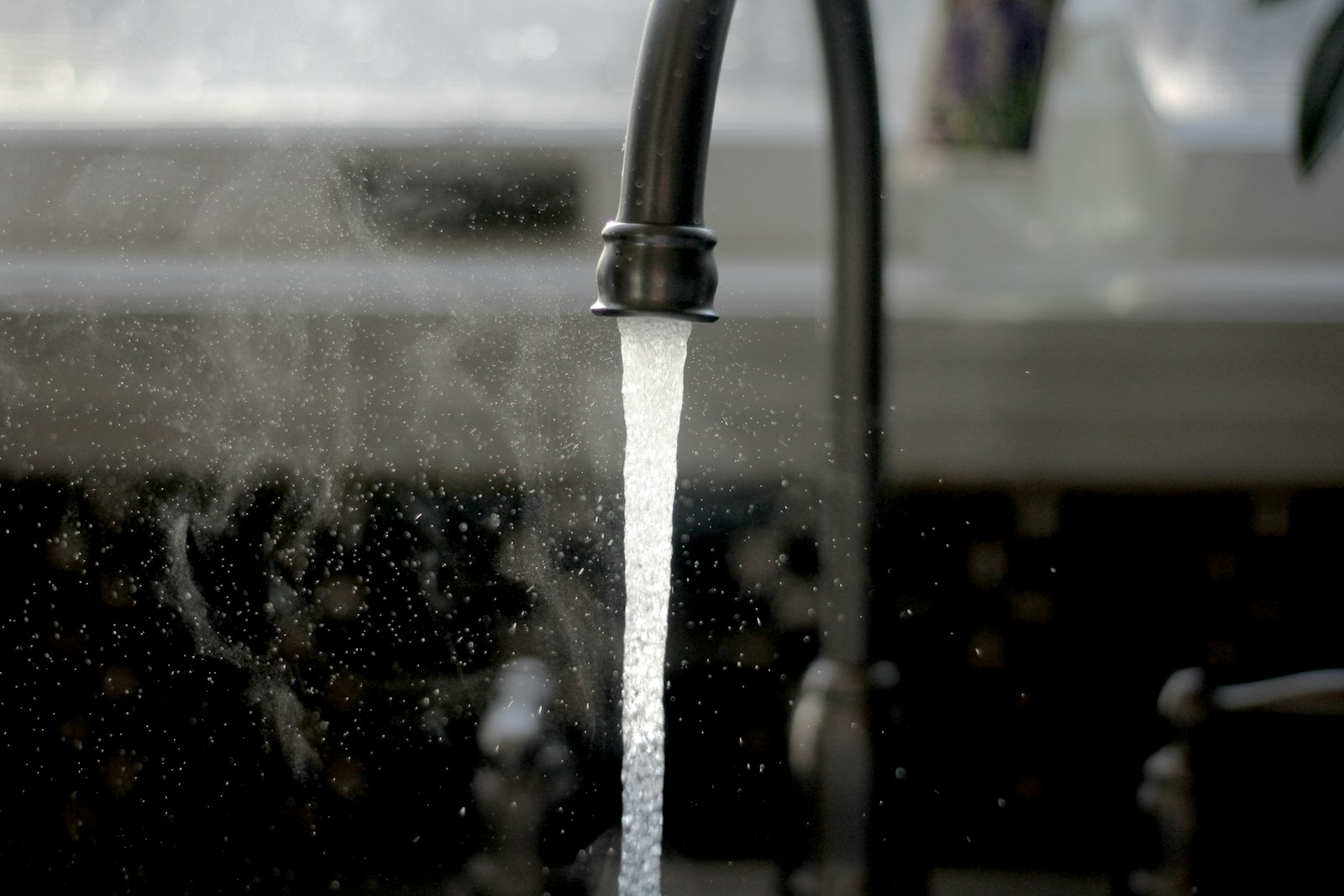 Close-up of running water from a kitchen faucet